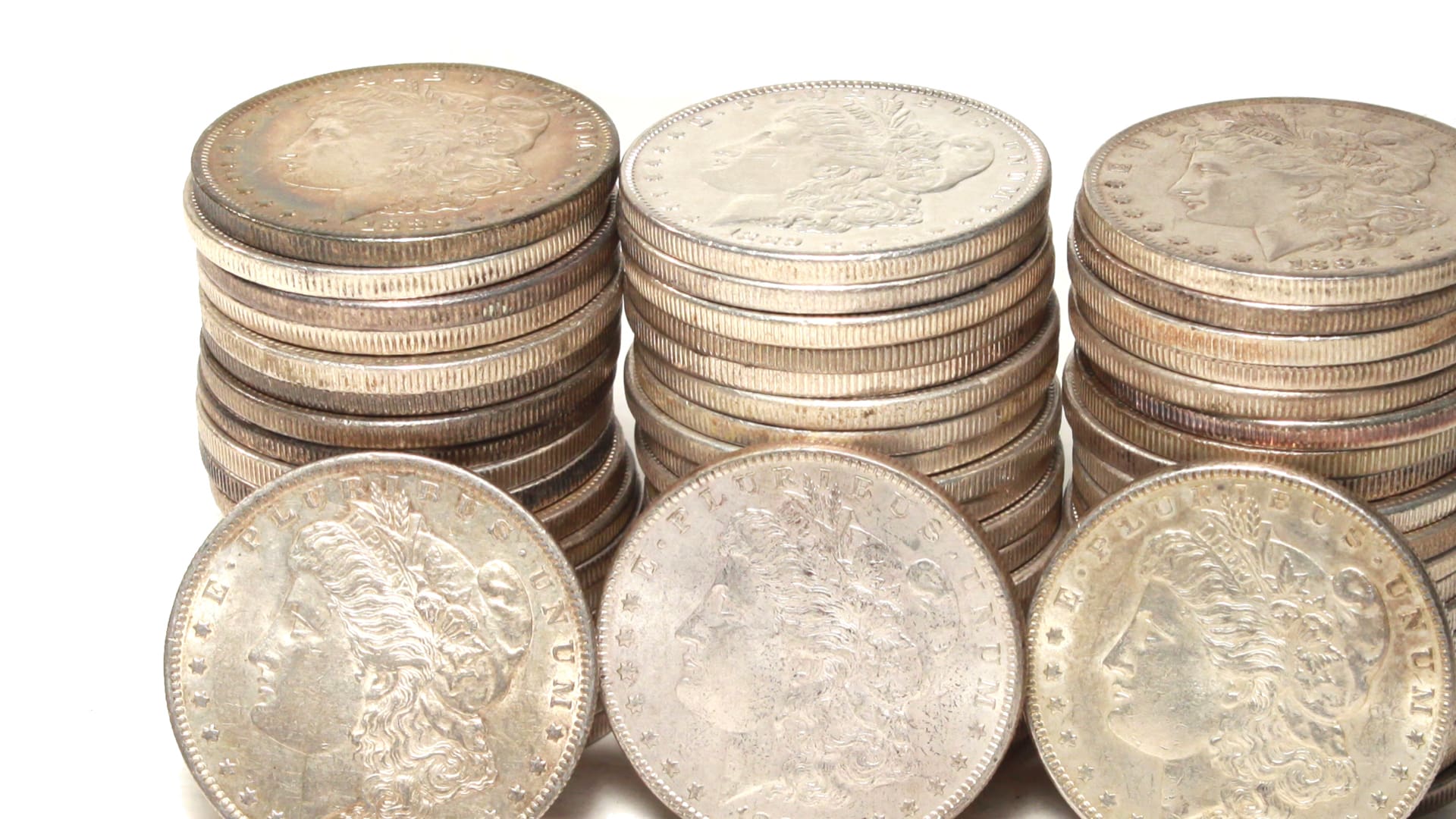 Silver coins Morgan dollars stacked for collectors