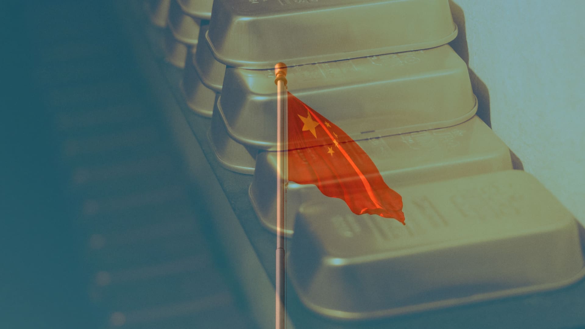 China gold reserve strategy symbolized by national flag and gold bars